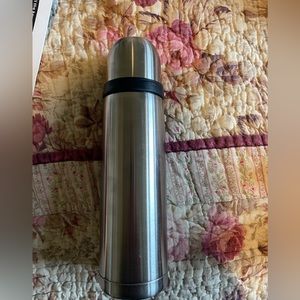 Starbucks silver thermos.